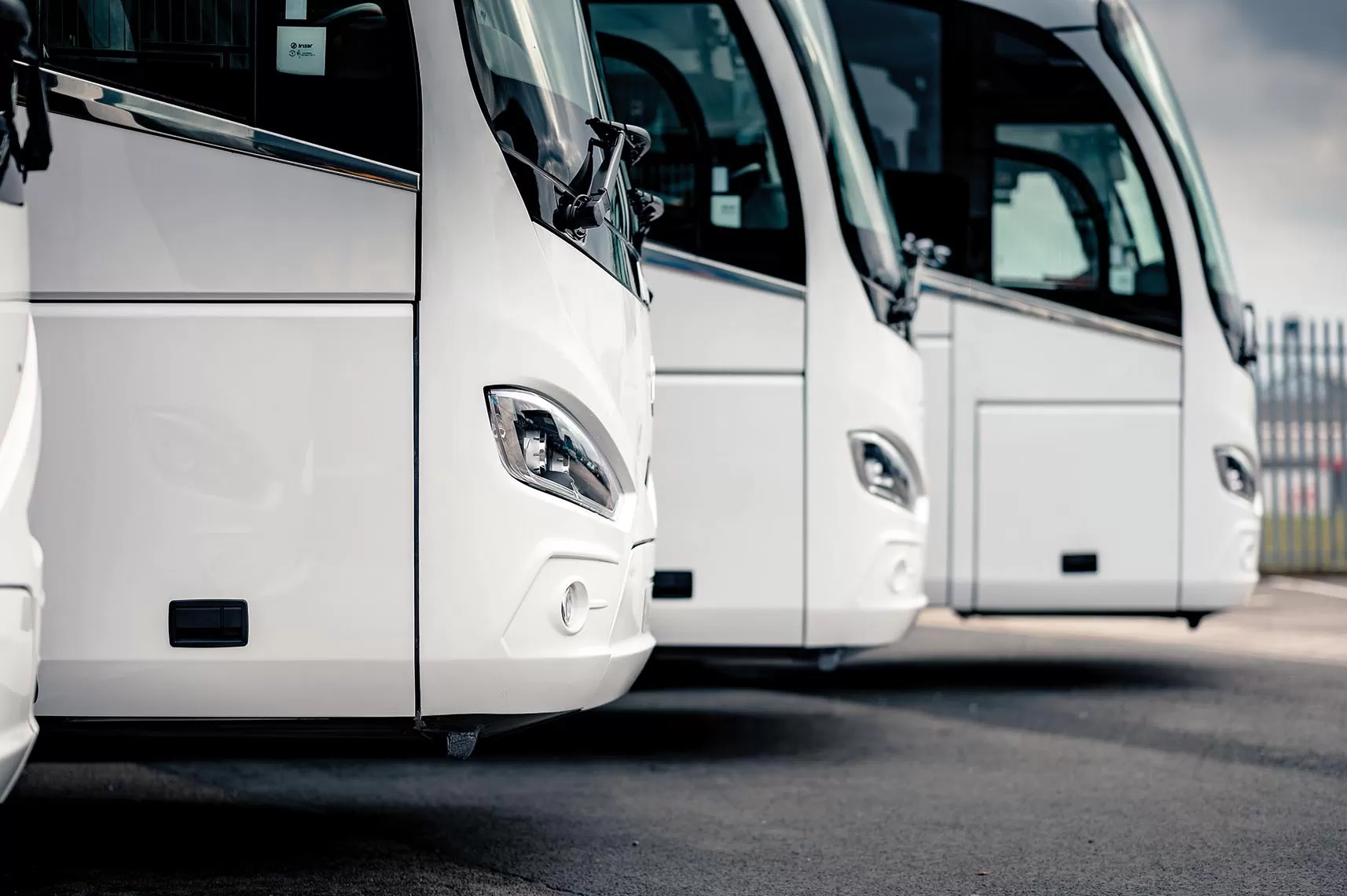 4 white coaches lined up