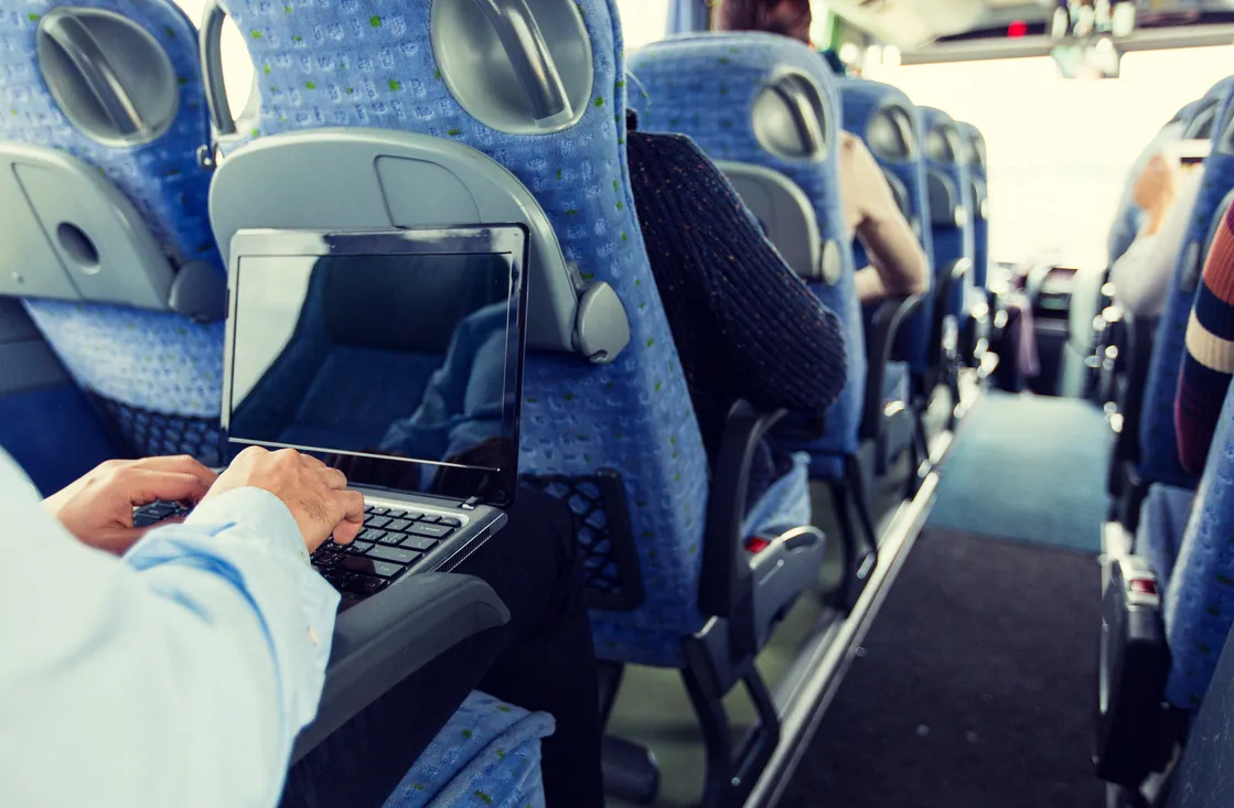 man on laptop on coach
