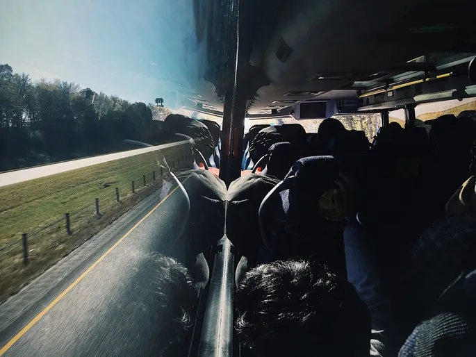 people travelling in coach enjoying the view