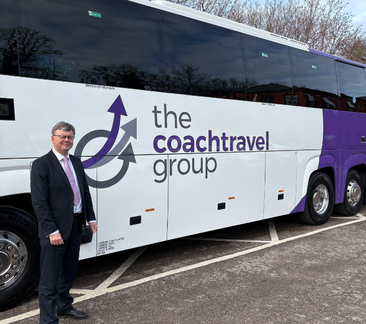 Tom Stables, CEO, next to new coach.